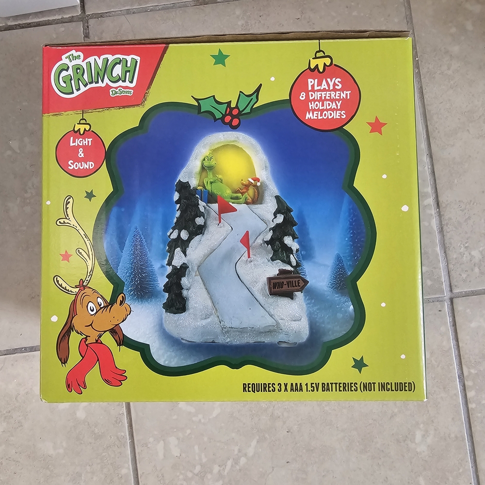 Sold.       The Grinch Holiday Decoration with Light and Sound